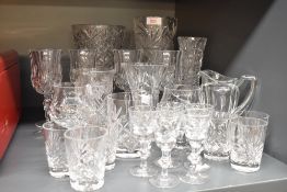 A selection of cut glass including vases and assorted drinking glasses