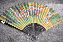 A large decorative hand painted Oriental fan approximately 170cm x 100cm.