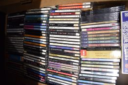 A large assortment of Compact Discs as in photos - all across the board - online / shop