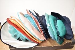 A collection of fourteen 20th-century wide-brimmed occasion hats for women, including makers such as