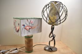 A modern Homebase polished chrome lamp with floral shade and architectural form, 65cm sold with a