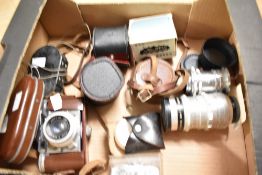 Braun Paxette 35mm camera, with a 45mm f2.8 lens, a Meyer-Optik 100mm f2.8 lens and other
