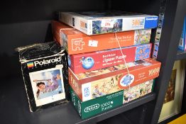 Six assorted jigsaw puzzles of mainly 500 and 1000 pieces.