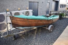 A 12ft wooden sailing dingy complete with vintage British Seagull and boat trailer