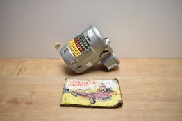 A vintage buss conductors ticket machine sold with a Brooke Bond Tea cards 'the History of the Motor