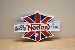 A cast Norton sign