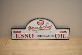 A cast Esso Oil sign