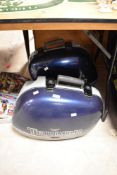 A pair of Triumph Motorcycle Panniers in blue