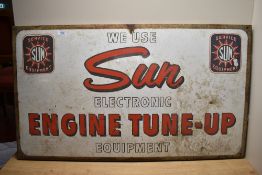 A metal sign 'We use Sun Electronic Engine Tune-up Equipment' Thought to originally have been