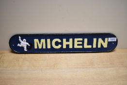 A cast Michelin sign