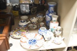 A selection of 20th-century Oriental ceramics, featuring a quantity of decorative plates with