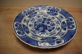 A large mid 20th-century De Koninklijke Porceleyne Fles Delft ware blue charger painted by W.M.G
