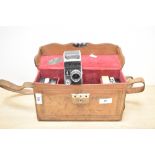 A Paillard-Bolex cine camera with Switar 1:1,5 f=12.5mm lens in leather case with cassettes