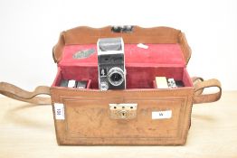 A Paillard-Bolex cine camera with Switar 1:1,5 f=12.5mm lens in leather case with cassettes
