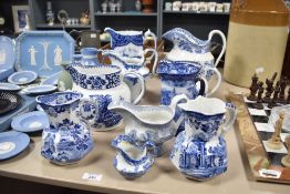 Ten vintage blue and white ceramic jugs of varied sizes including Mason's Ironstone, Copeland