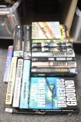A collection of modern hardback fiction books, to include authors Jack Higgins, Clive Cussler and