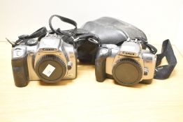 Two Canon EDS and EDS 300x bodies sold with one leather case.