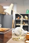 A large vintage Anglepoise desk lamp, in a buttery-yellow colour, 84cm at full extension,