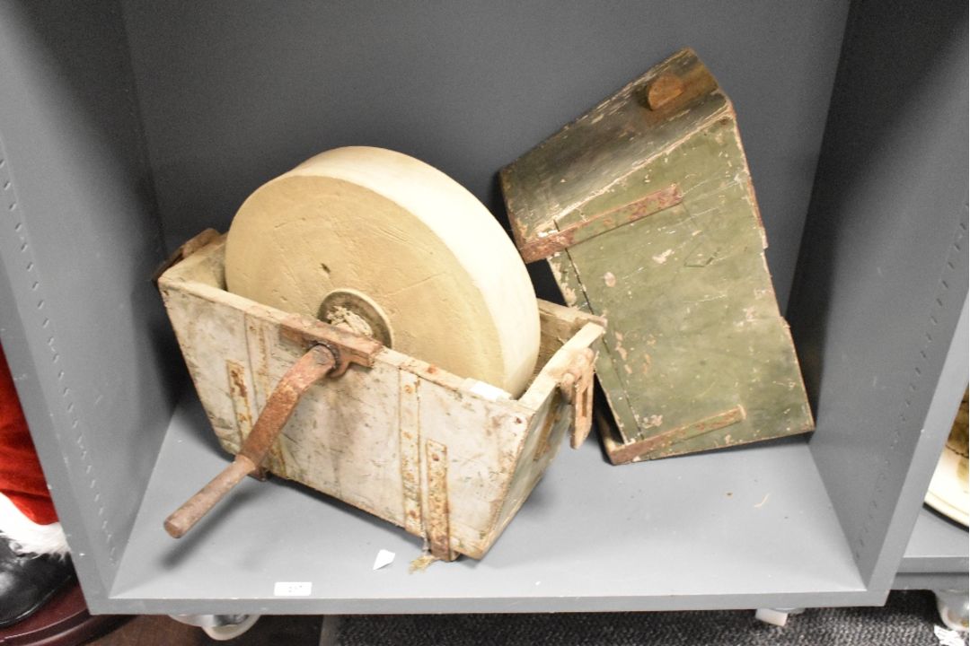 A Victorian sand stone grinding/sharpening wheel, featuring a large, circular stone wheel and a hand - Image 1 of 2