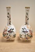 A pair of late 19th-century German Royal Bonn porcelain mantle vases, featuring tall, slender