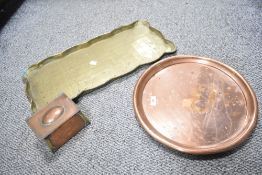 A large rectangular, scalloped brass serving tray sold together with a circular cooper serving