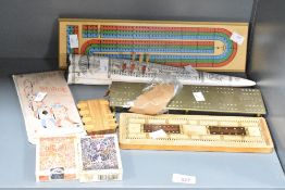 A collection of late 20th-century to modern cribbage boards, which are used to keep score in the