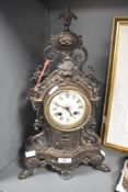 A large 19th-century French Rococo-style gilt metal mantel clock, having Roman hours and Arabic