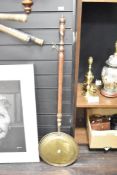 An early 20th-century turned wood, brass and copper bed warmer, 110cm, condition is consistent