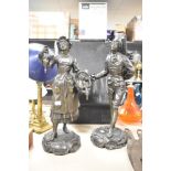 A pair of French bronzed spelter statues, featuring a female titled Marchande de Volailles (