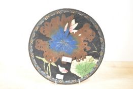 A 19th-century Japanese cloisonné enamel charger, presumed Meiji period, featuring a selection of