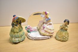 Three 20th-century porcelain figurines to include, a Royal Doulton-style porcelain figurine with a