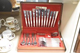 A 20th-century Viners stainless steel 'Sable' cutlery set, in its original presentation box, to