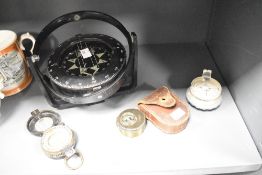 An interesting Negretti & Zambra pocket compass, of typical circular form with hinged cover having