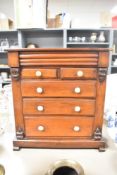 A Victorian tabletop mahogany chest of drawers, presumed apprentice piece, with a two over three