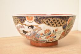 A 20th-century Chinese porcelain charger, featuring two central figures in traditional attire within