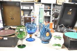 A large vintage clear glass Galileo thermometer featuring a set of floating spheres with silver