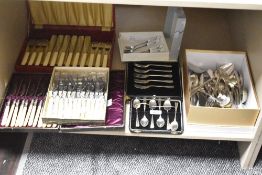 A large assortment of mainly cased silver-plated cutlery and flatware to include cake forks and fish