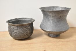 An antique Omani turned copper vessel, of traditional decorative design, sold together with a