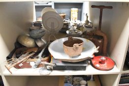 An assortment of vintage kitchenalia and similar items to include a cast iron lard press, a small