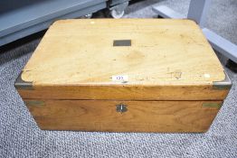 A Victorian brass mounted walnut box having brass corners and handles, inscribed ‘D.H. Mouson’ to