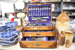 A large 20th-century Gregory Brothers Cutlers of Sheffield stainless steel cutlery canteen of oak