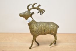 A mid 20th-century cast brass red deer, of Persian style, featuring a highly decorative body of King