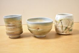 Two contemporary Jack Doherty (born 1948) porcelain yunomi covered in soda vapour glaze with incised