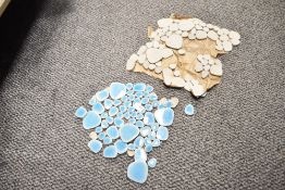 An assortment of decorative joycolor mosaic tiles.
