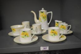 A 20th-century Noritake 'Buttercup' pottery coffee service, featuring soft butter yellow floral