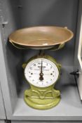 A 20th-century British cast iron Improved Salter Family Scale, Number 50, with an olive green