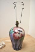 A 20th-century studio pottery lamp base, of baluster form, featuring hand painted abstract floral