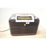 A mid 20th-century Art Deco-style Bush DAC10 radio, with a bakelite cabinet and faux tortoiseshell
