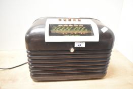A mid 20th-century Art Deco-style Bush DAC10 radio, with a bakelite cabinet and faux tortoiseshell