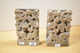 Two thought to be 20th-century Chinese carved soapstone bookends, of square-form, featuring a